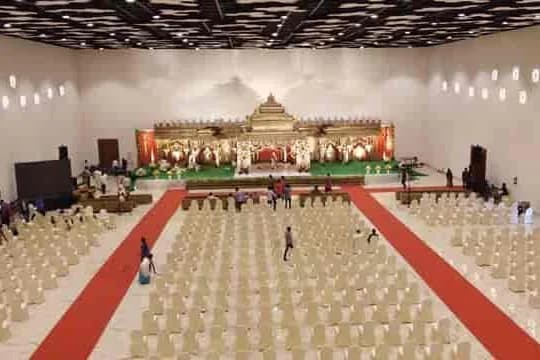 The main hall at CK Conventions with the stage and rows of seating